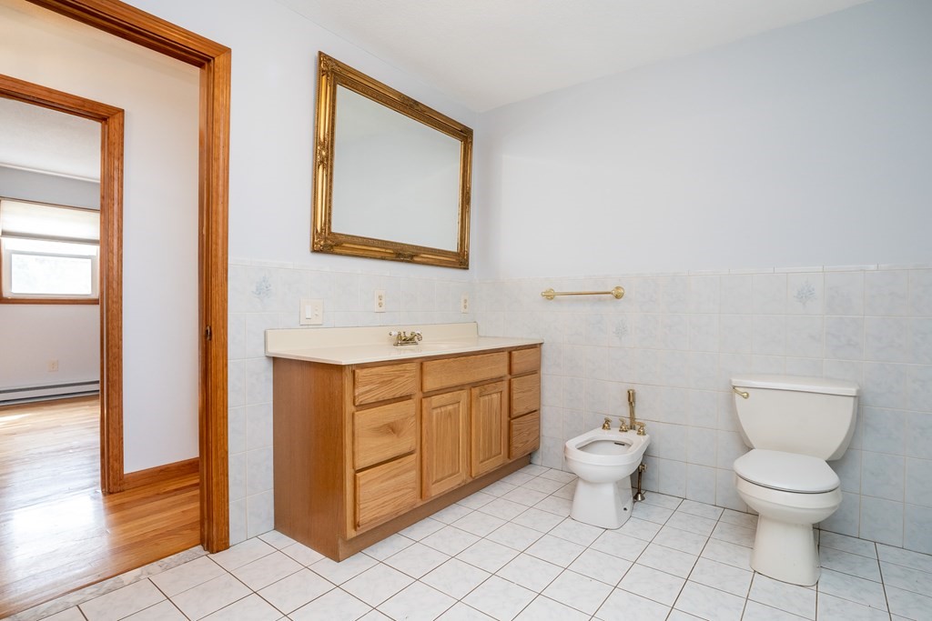 127 Upper Hampden Road Monson, MA 01057 - Photo 37 of 42 a bathroom with a toilet sink and mirror