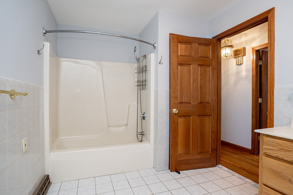 127 Upper Hampden Road Monson, MA 01057 - Photo 38 of 42 a bathroom with a bathtub and a shower
