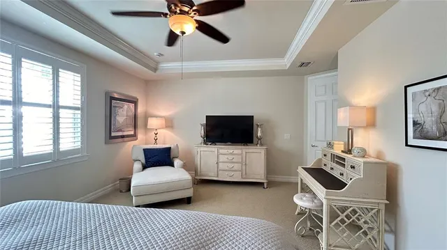 a bedroom with a bed a desk and chair