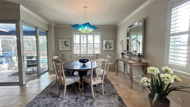 a kitchen with kitchen island granite countertop a sink counter top space appliances and cabinets