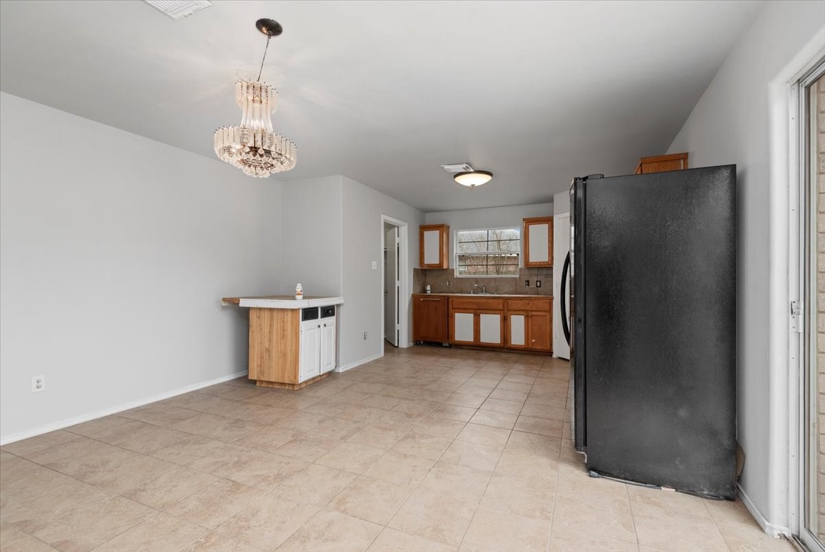 5518 Rio Alamo Street Rosharon, TX 77583 - Photo 7 of 25 a view of a kitchen with fridge and windows