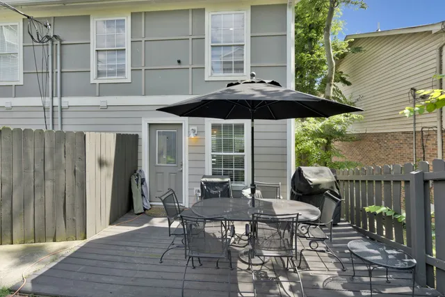 a patio with table and chairs