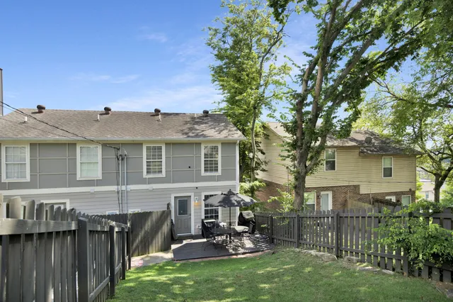 a view of a house with backyard porch and sitting area