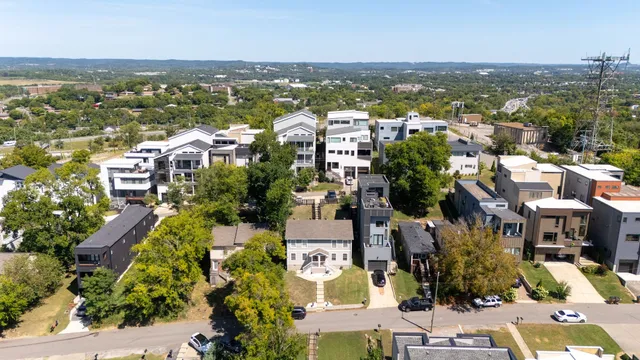 an aerial view of a city with lots of residential buildings