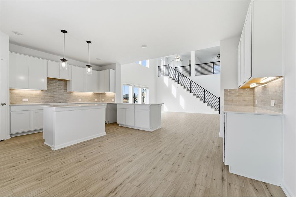 228 Charismatic Road Waxahachie, TX 75165 - Photo 12 of 23 a view of kitchen with wooden floor and electronic appliances