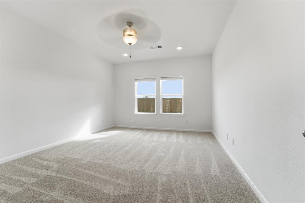 228 Charismatic Road Waxahachie, TX 75165 - Photo 19 of 23 an empty room with a window