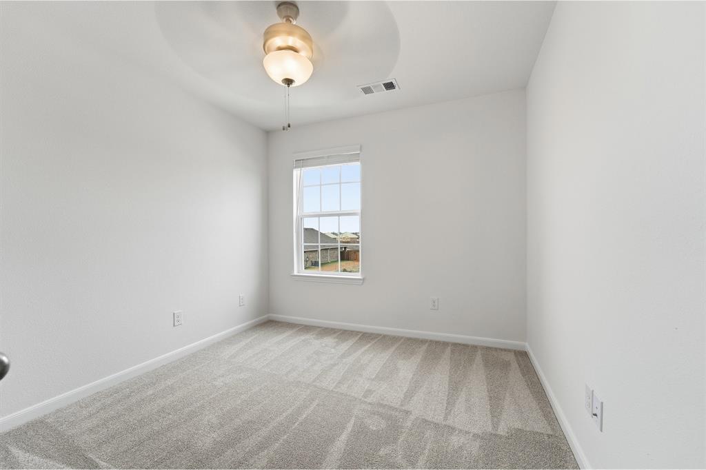 228 Charismatic Road Waxahachie, TX 75165 - Photo 20 of 23 an empty room with a window