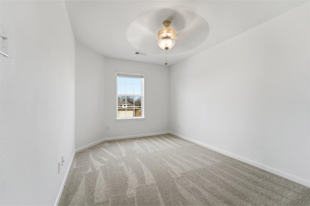 228 Charismatic Road Waxahachie, TX 75165 - Photo 22 of 23 an empty room with a window