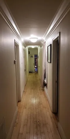 a view of a room with furniture and a flat screen tv