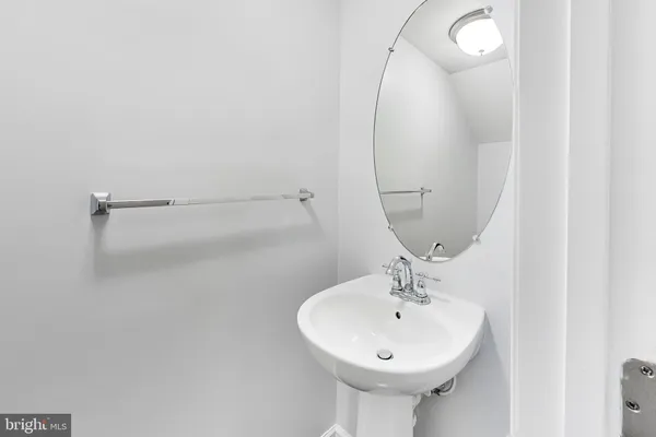 a bathroom with a sink a mirror and shower