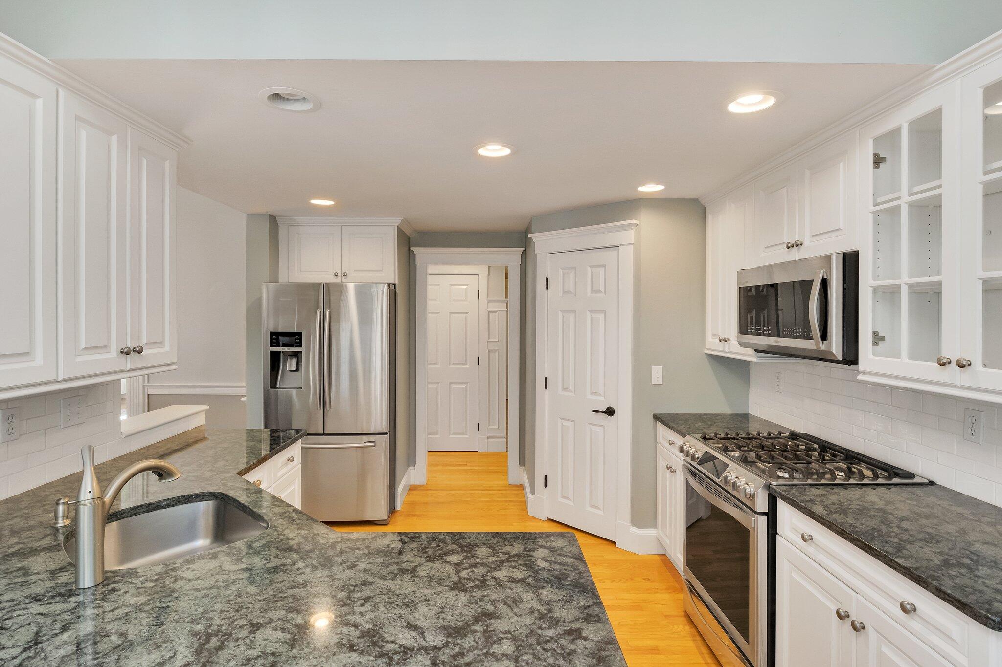 15 Regatta Drive Mashpee, MA 02649 - Photo 15 of 55 a kitchen with stainless steel appliances granite countertop a stove a sink and a refrigerator
