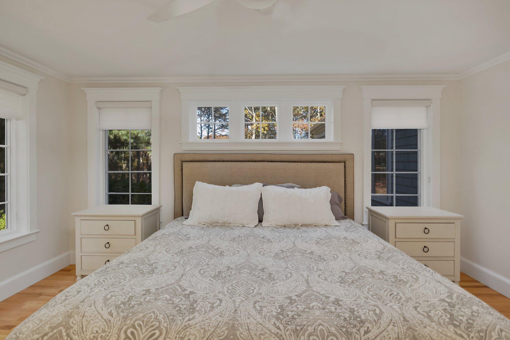 15 Regatta Drive Mashpee, MA 02649 - Photo 21 of 55 a bedroom with a large bed and a window