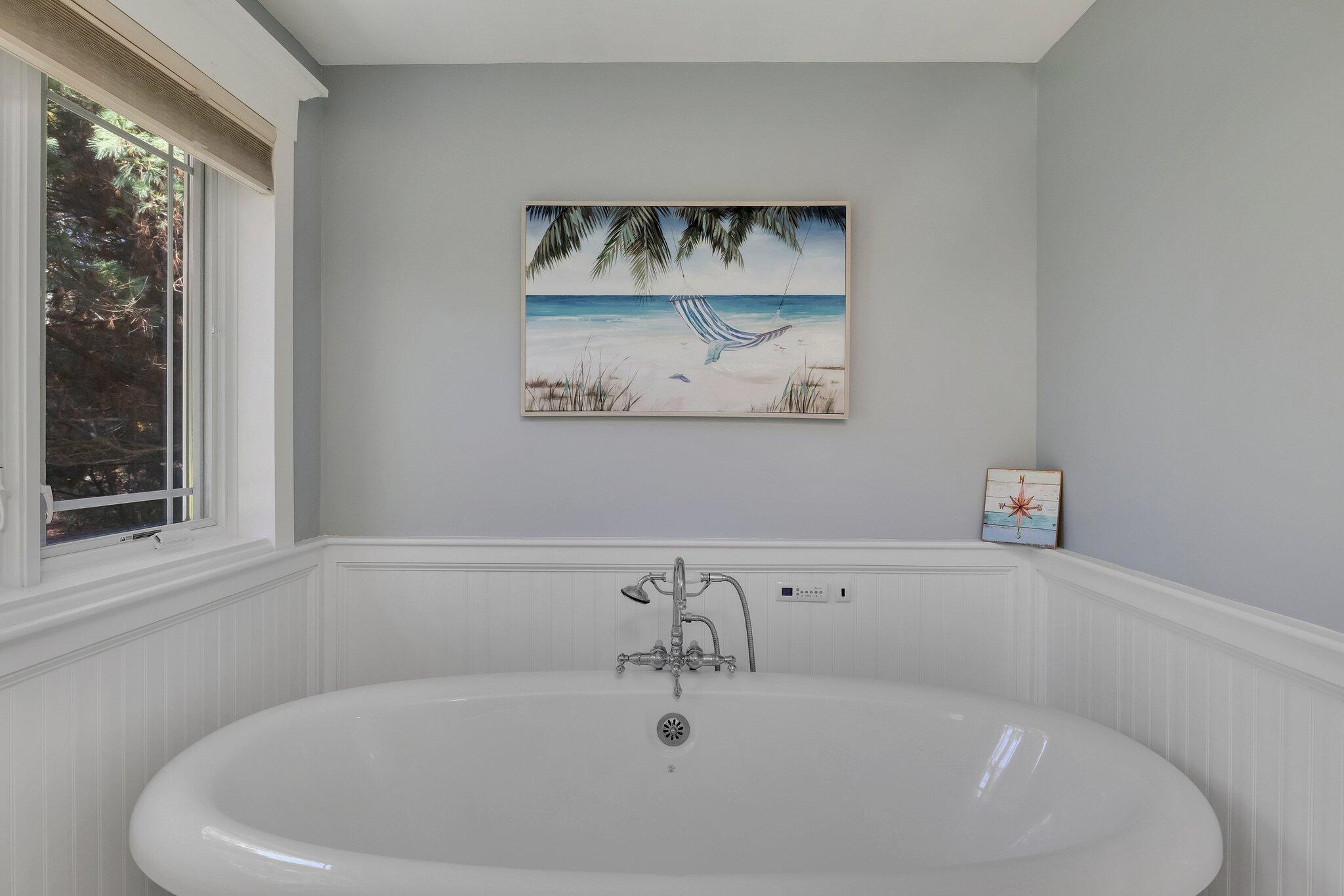15 Regatta Drive Mashpee, MA 02649 - Photo 22 of 55 a white bath tub sitting in a bathroom
