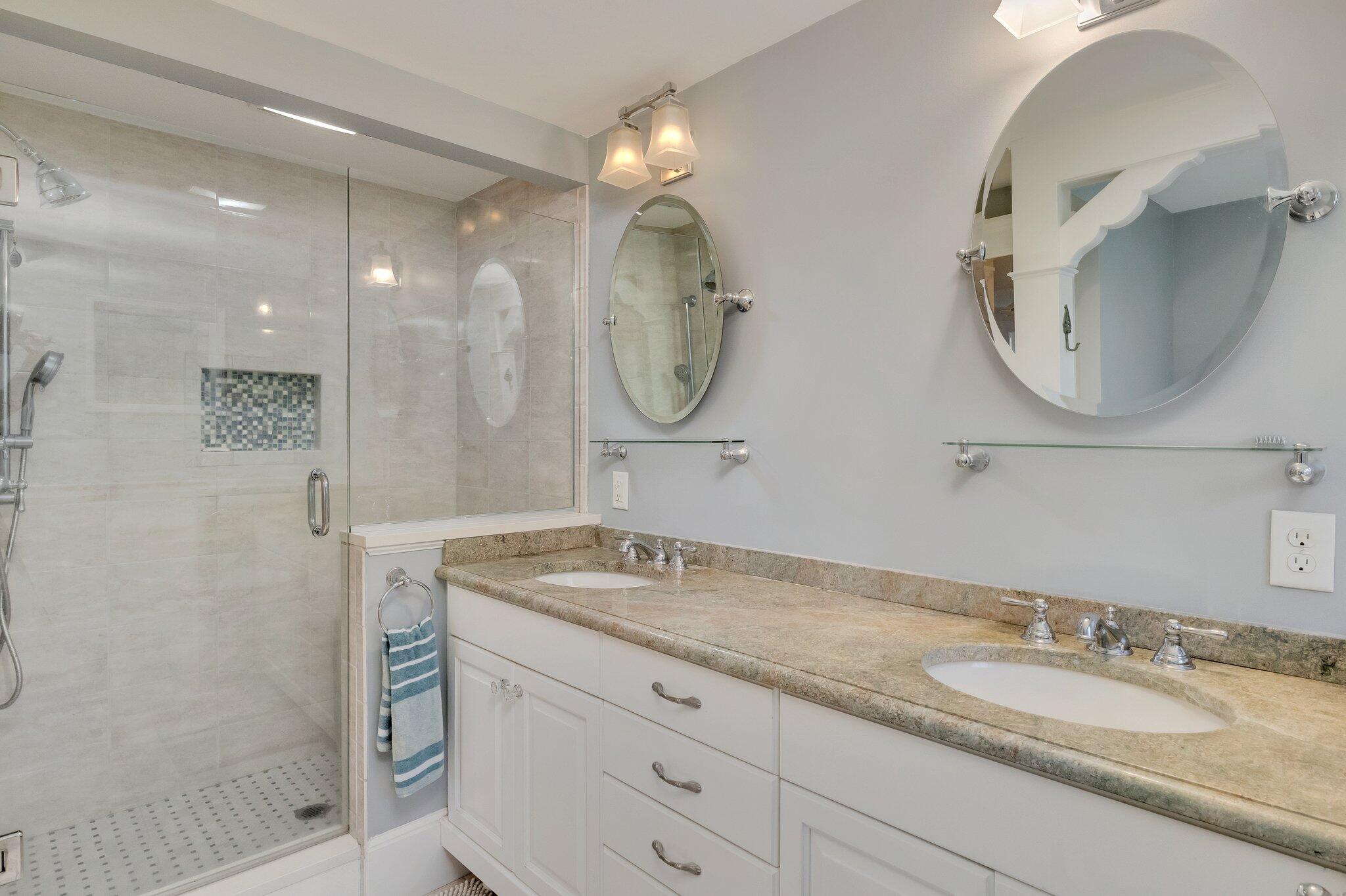 15 Regatta Drive Mashpee, MA 02649 - Photo 23 of 55 a bathroom with a granite countertop double vanity and a mirror