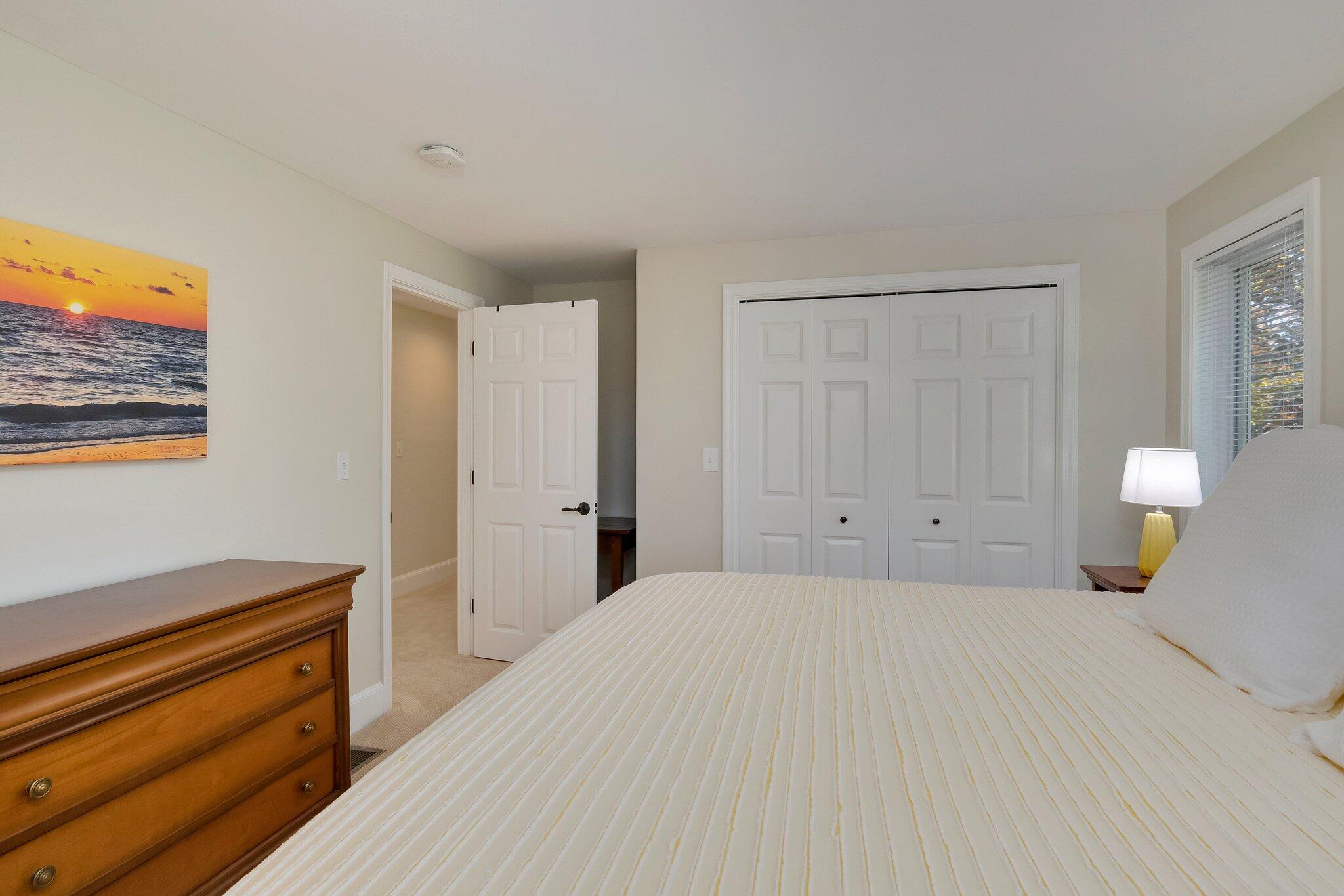 15 Regatta Drive Mashpee, MA 02649 - Photo 30 of 55 a large white bed in a white room