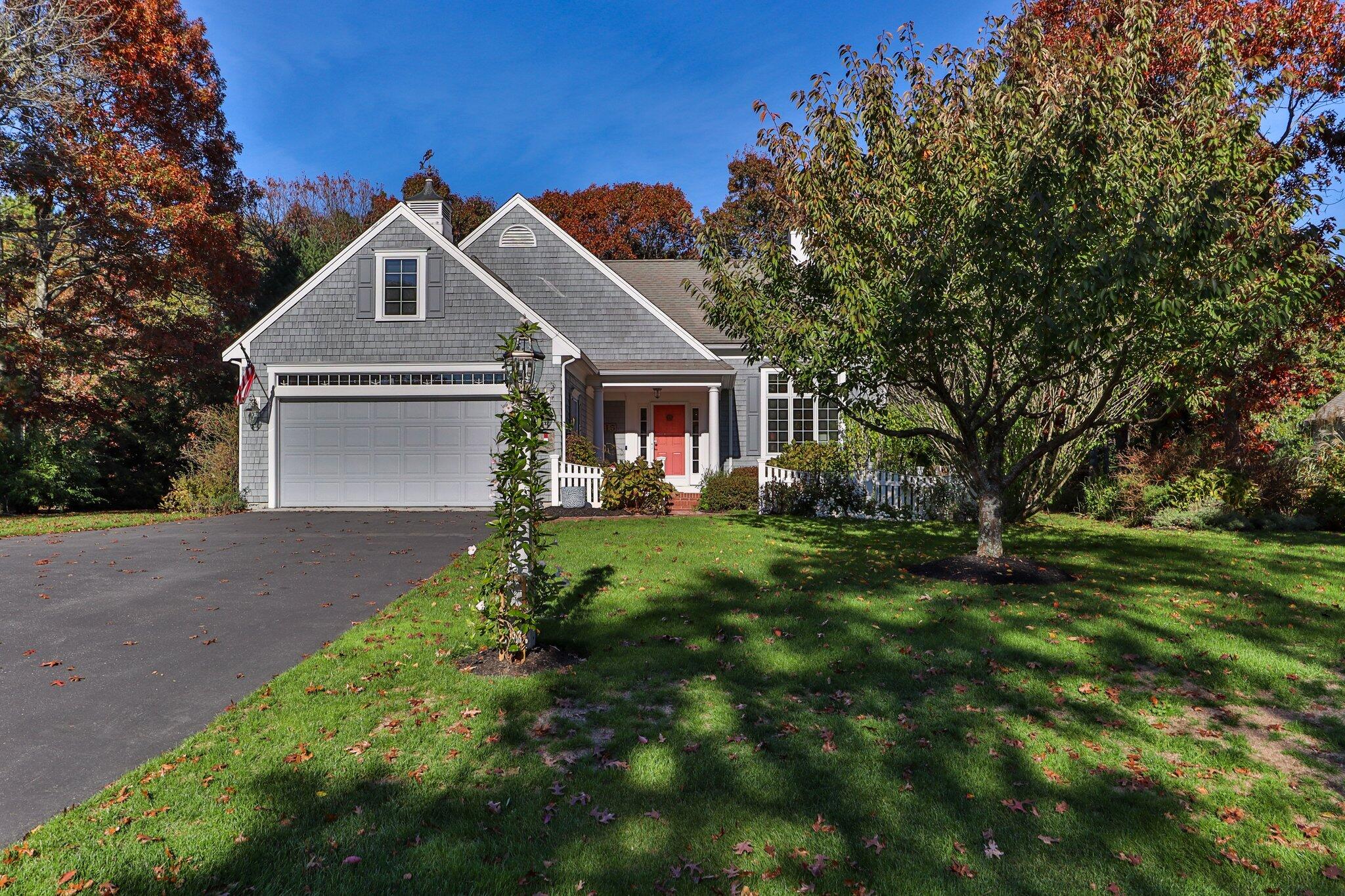 15 Regatta Drive Mashpee, MA 02649 - Photo 3 of 55 a front view of a house with a yard