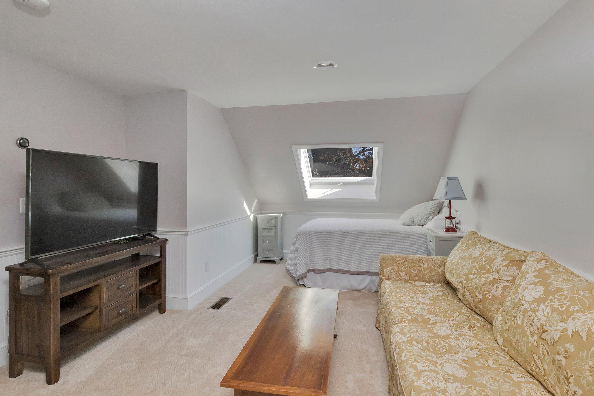 15 Regatta Drive Mashpee, MA 02649 - Photo 33 of 55 a living room with furniture and a flat screen tv