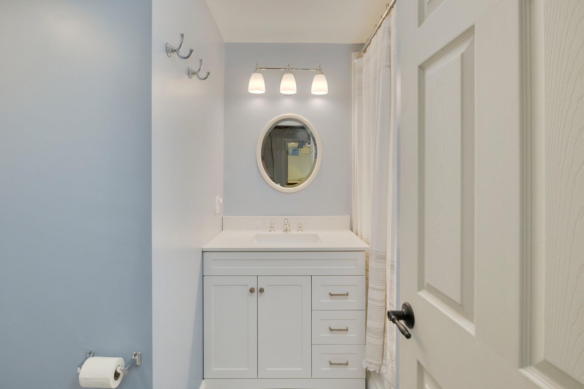 15 Regatta Drive Mashpee, MA 02649 - Photo 38 of 55 a bathroom with a sink and a mirror