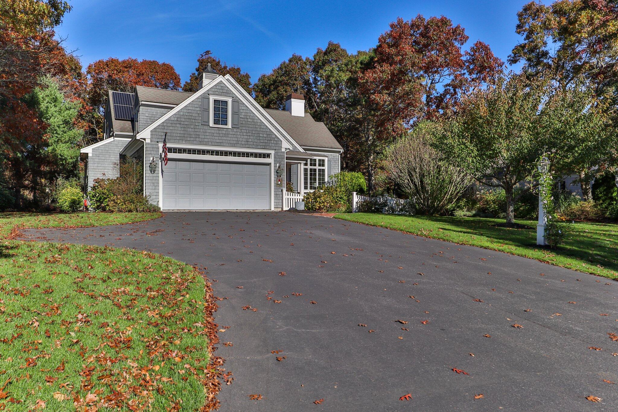 15 Regatta Drive Mashpee, MA 02649 - Photo 40 of 55 a front view of a house with a garden