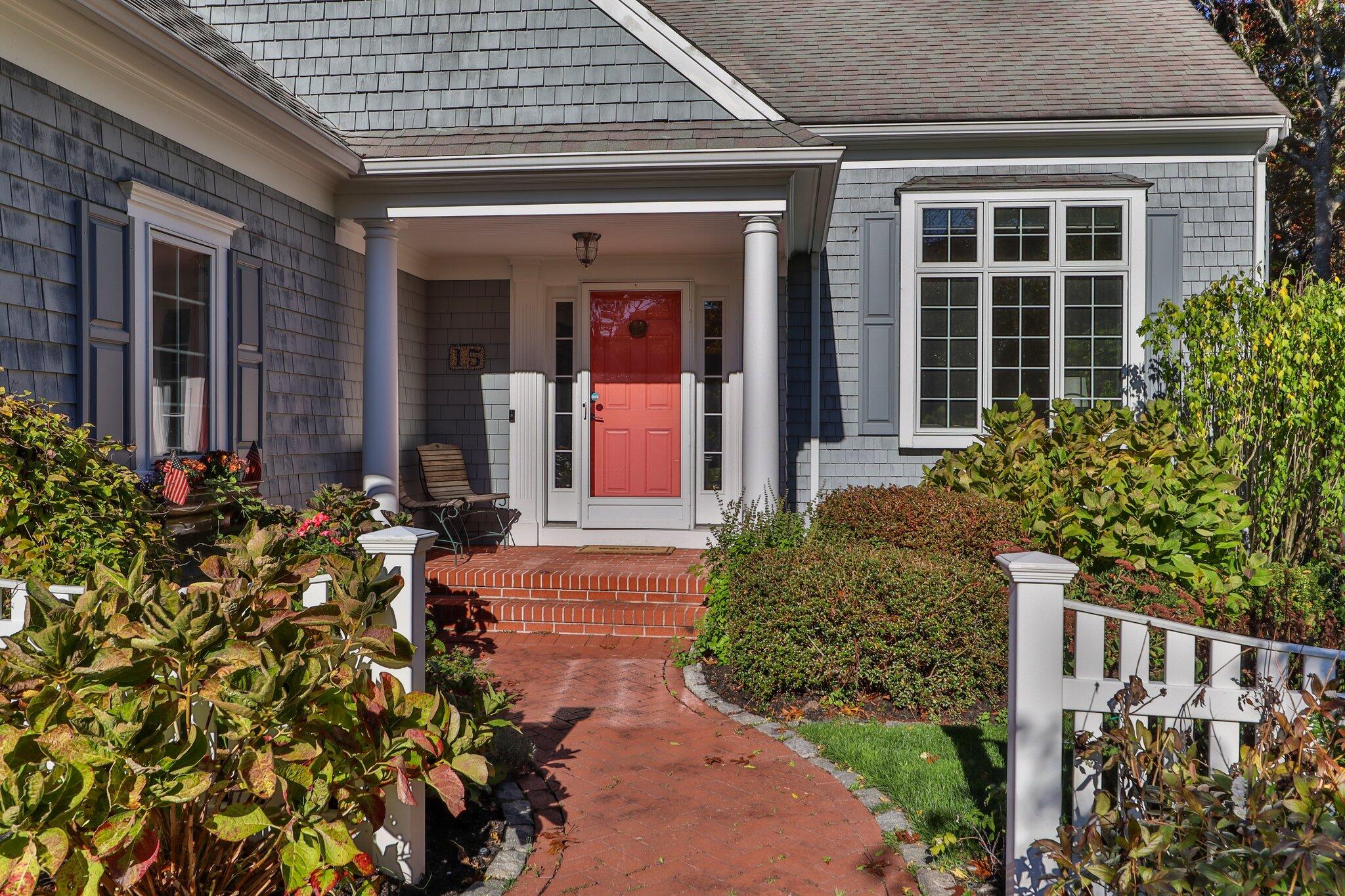 15 Regatta Drive Mashpee, MA 02649 - Photo 4 of 55 front view of a house with a small yard