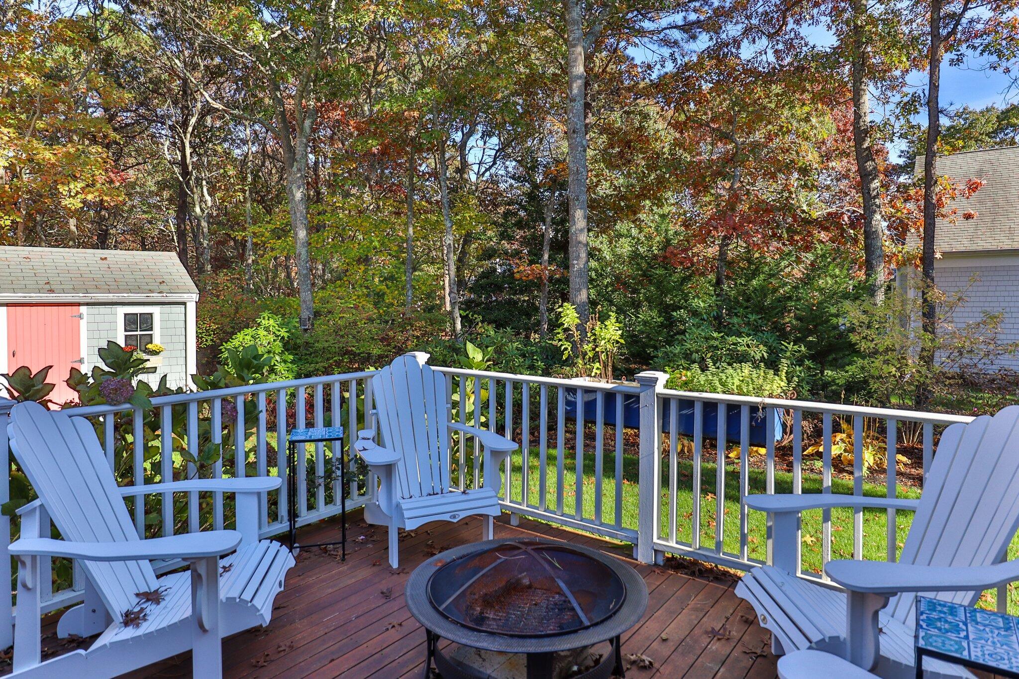 15 Regatta Drive Mashpee, MA 02649 - Photo 45 of 55 a view of a wooden deck and a back yard