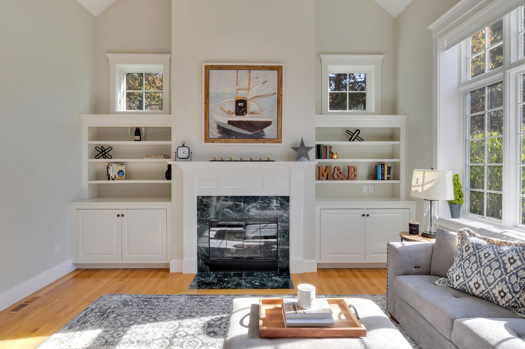15 Regatta Drive Mashpee, MA 02649 - Photo 7 of 55 a living room with furniture and a fireplace