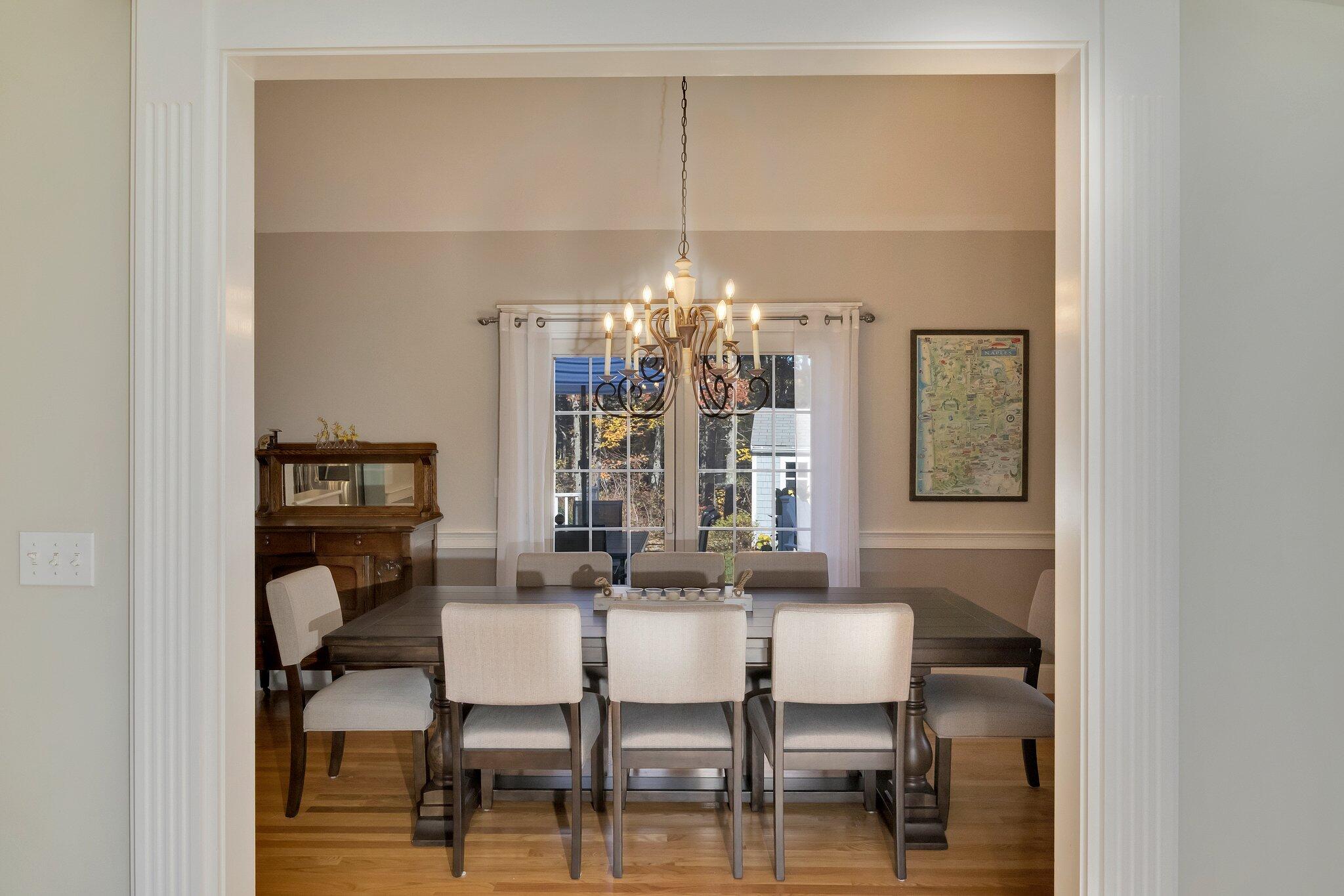 15 Regatta Drive Mashpee, MA 02649 - Photo 10 of 55 a view of a dining room with furniture and chandelier