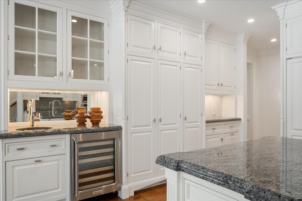 861 Bell Lane Winnetka, IL 60093 - Photo 13 of 57 a kitchen with white cabinets and sink