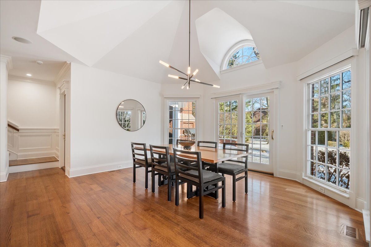 861 Bell Lane Winnetka, IL 60093 - Photo 15 of 57 a view of a dining room with furniture window and wooden floor