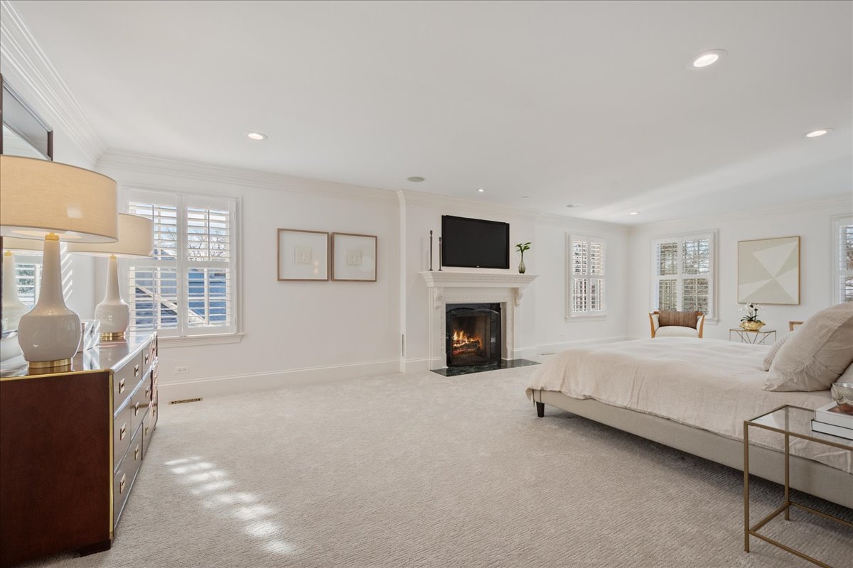 861 Bell Lane Winnetka, IL 60093 - Photo 30 of 57 a living room with furniture and a fireplace