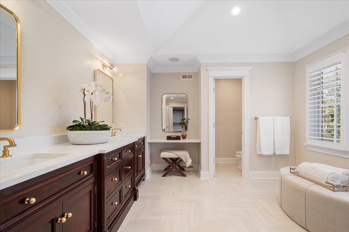 861 Bell Lane Winnetka, IL 60093 - Photo 34 of 57 a spacious en suite bathroom with a granite countertop tub and a sink