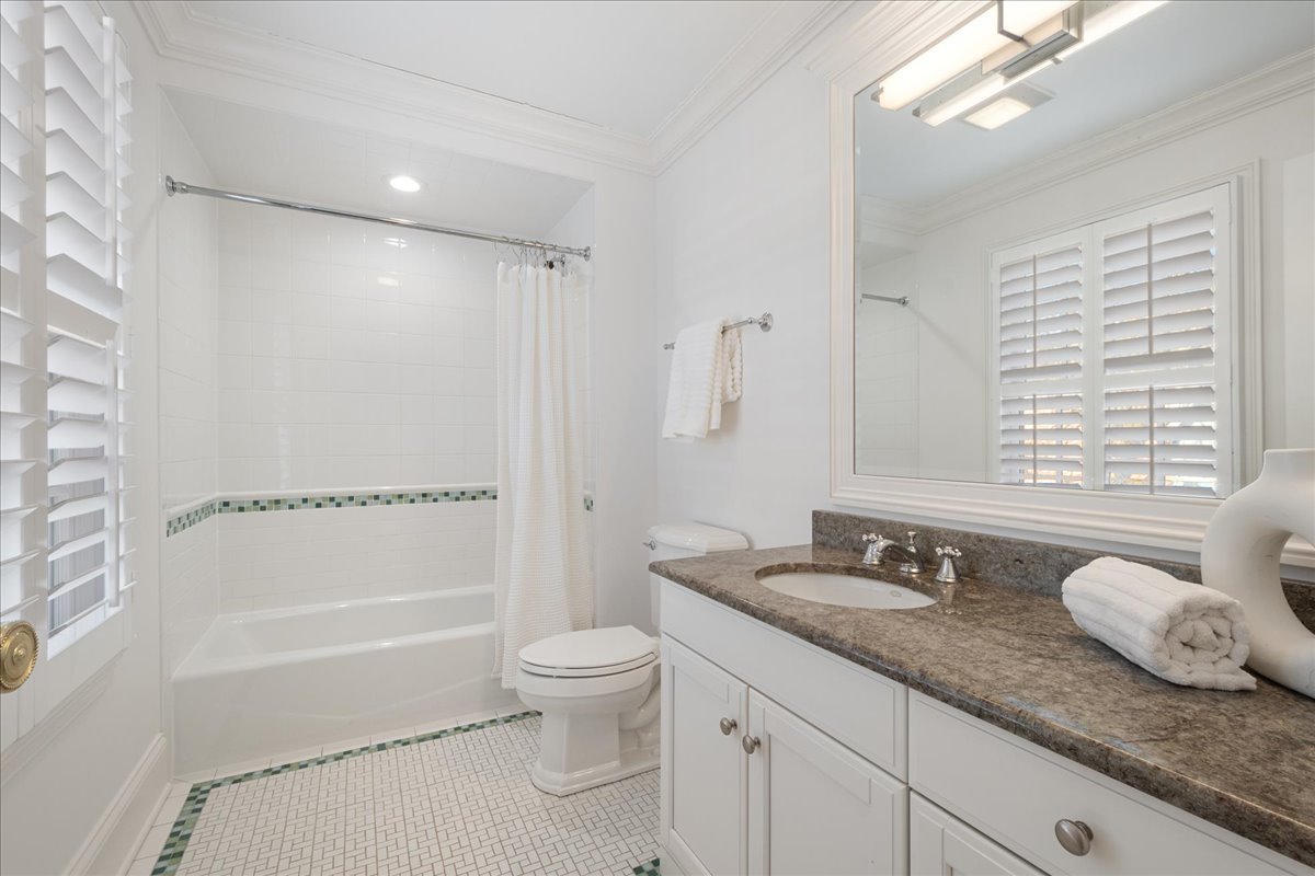 861 Bell Lane Winnetka, IL 60093 - Photo 38 of 57 a bathroom with a granite countertop sink toilet and shower