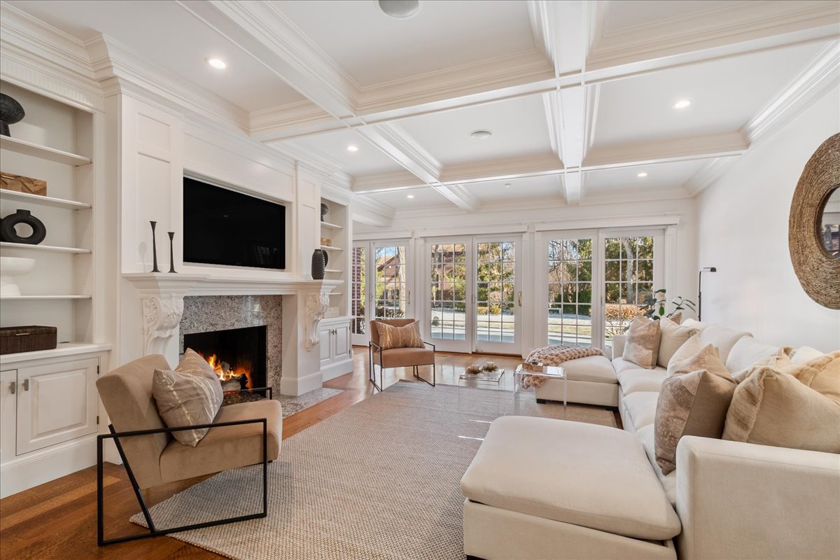 861 Bell Lane Winnetka, IL 60093 - Photo 4 of 57 a living room with furniture a fireplace and a flat screen tv