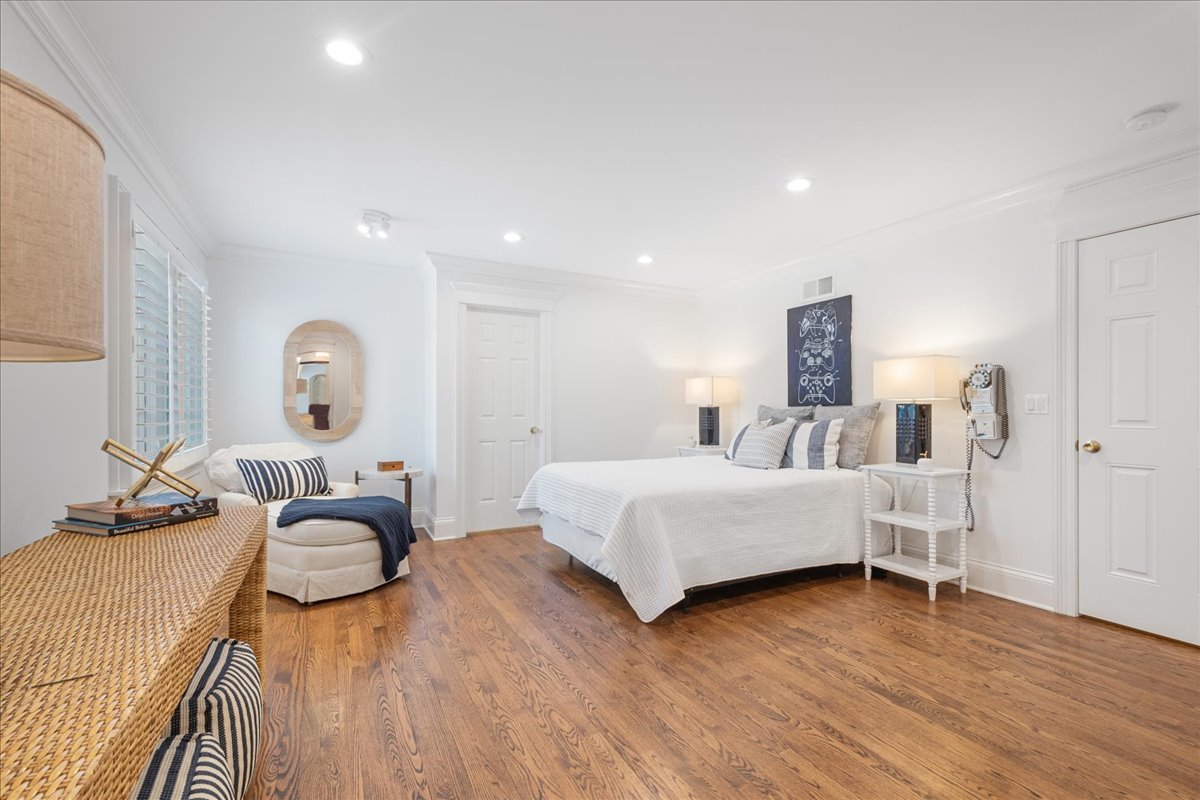 861 Bell Lane Winnetka, IL 60093 - Photo 41 of 57 a bedroom with furniture and a wooden floor