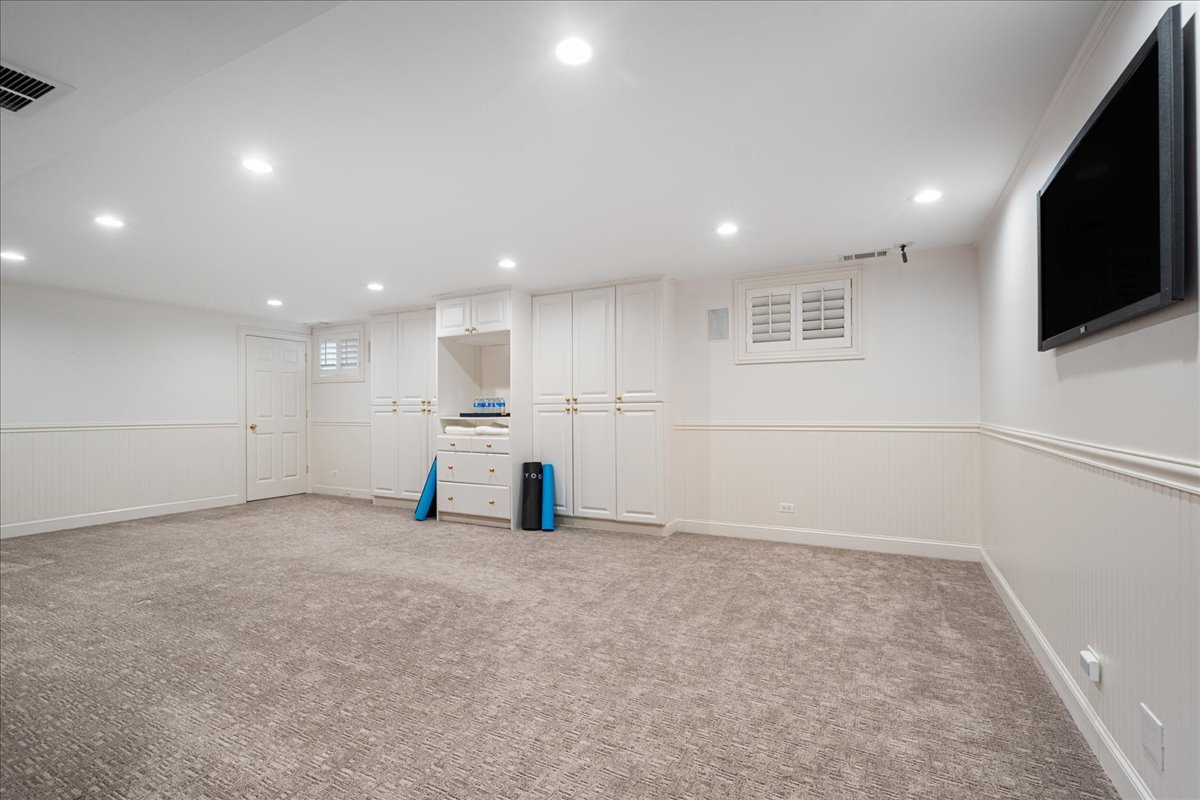 861 Bell Lane Winnetka, IL 60093 - Photo 46 of 57 a view of an empty room with kitchen view and a window
