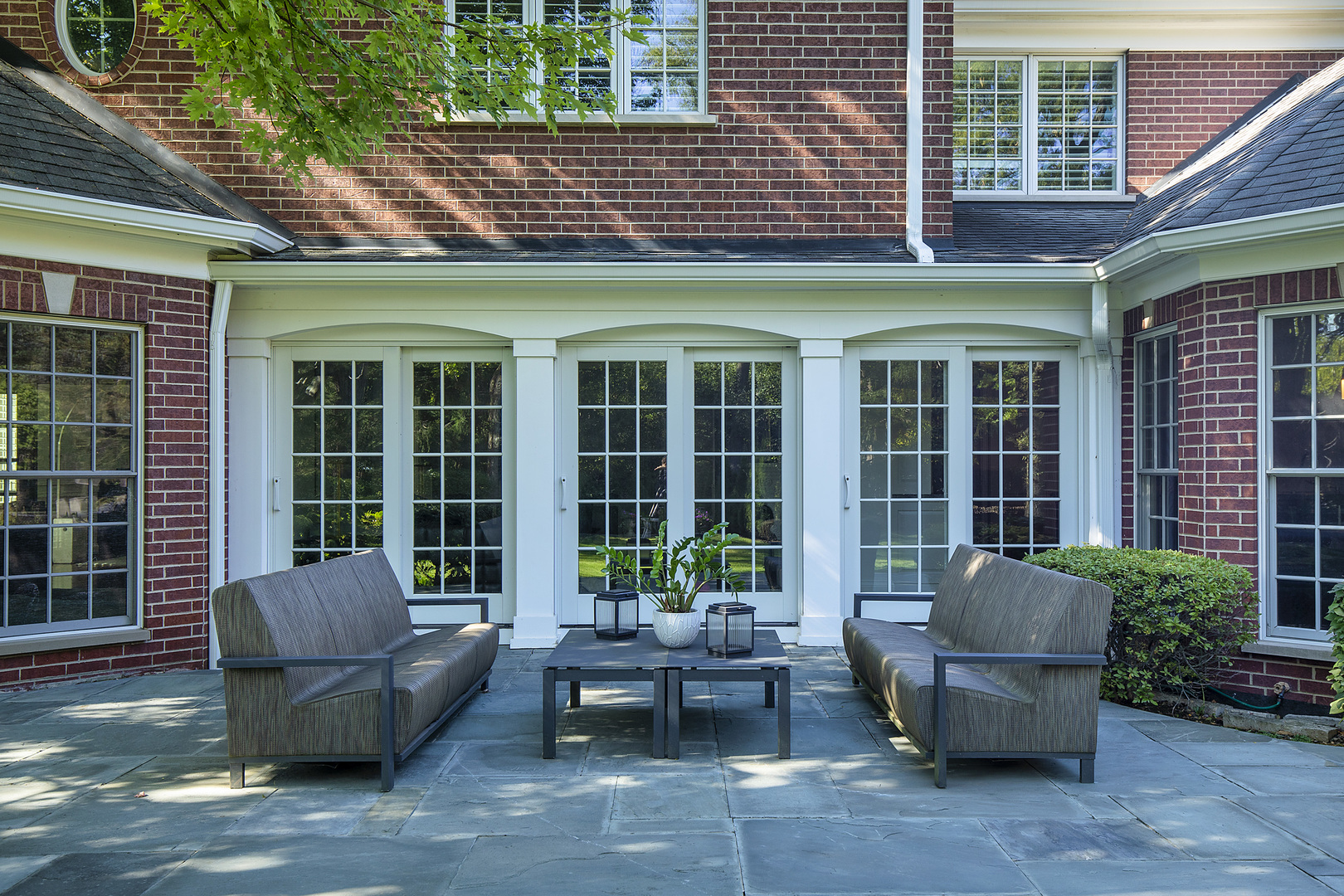861 Bell Lane Winnetka, IL 60093 - Photo 51 of 57 a view of a patio with a couch and a potted plant
