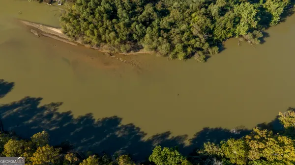 a view of a lake with a yard