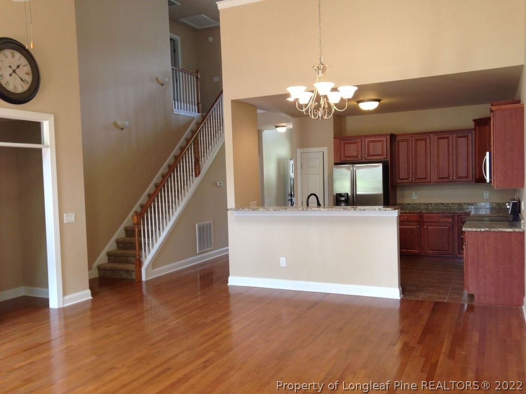 28 Hawk Ridge Drive Spring Lake, NC 28390 - Photo 2 of 5 a view of a kitchen with a sink a kitchen a refrigerator and a stove