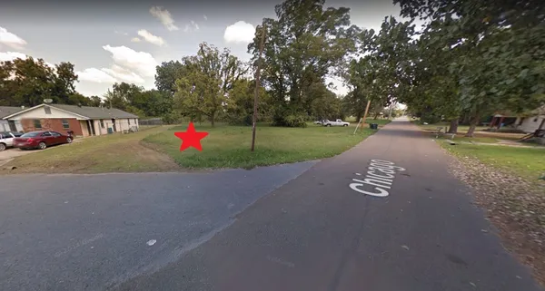 a view of outdoor space with garden and trees