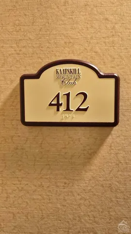 a bedroom with a bed and a view of bathroom