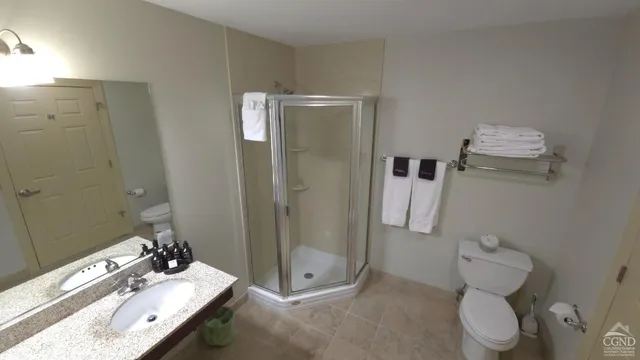 a kitchen with a table chairs refrigerator and microwave