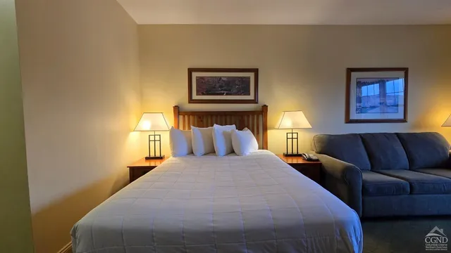 a bathroom with a toilet a sink and a mirror