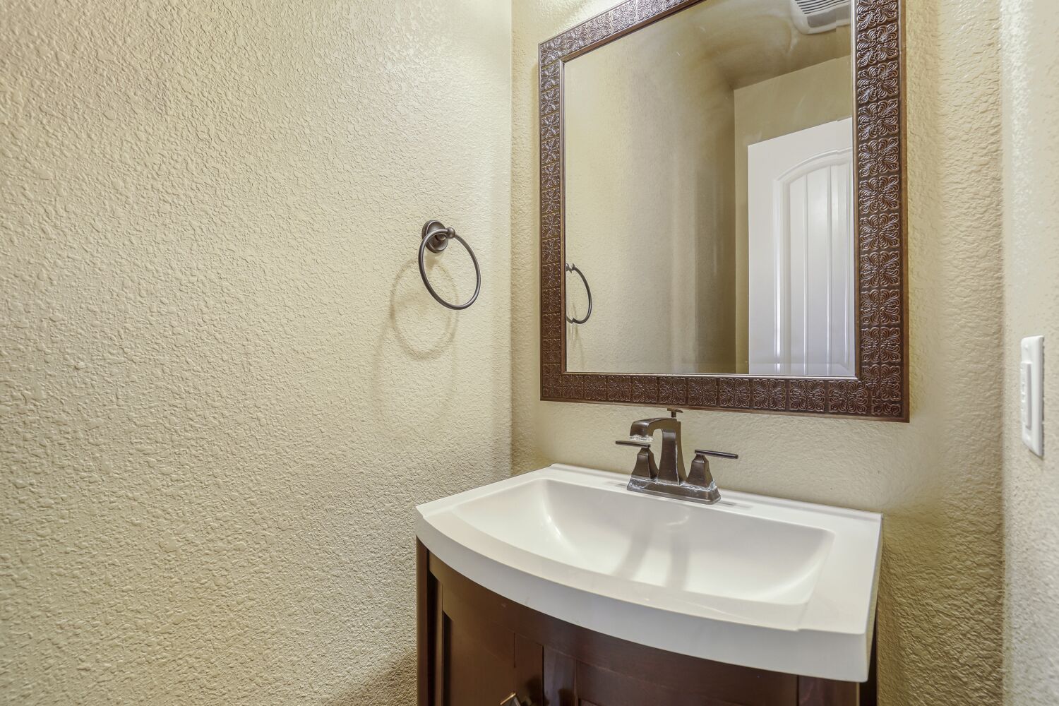 329 Jake Drive Jarrell, TX 76537 - Photo 9 of 17 Bathroom with a textured wall and vanity