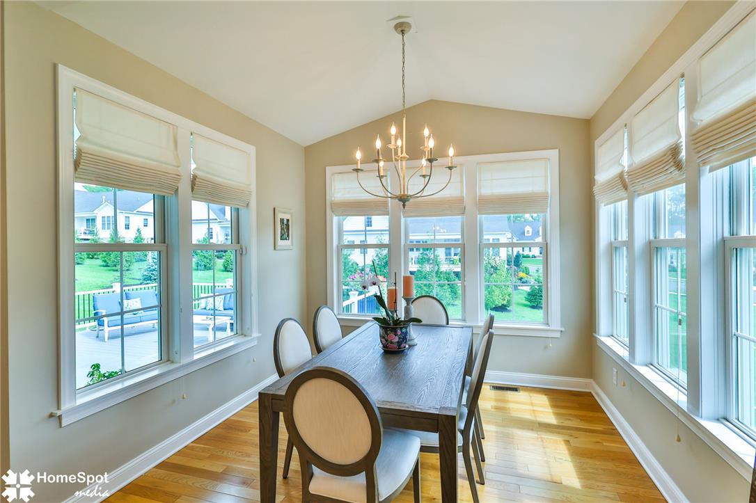 4473 Old Saucon Road Bethlehem, PA 18015 - Photo 9 of 26 Sunlight streams through multiple windows onto the hardwood floor of this vaulted dining area.