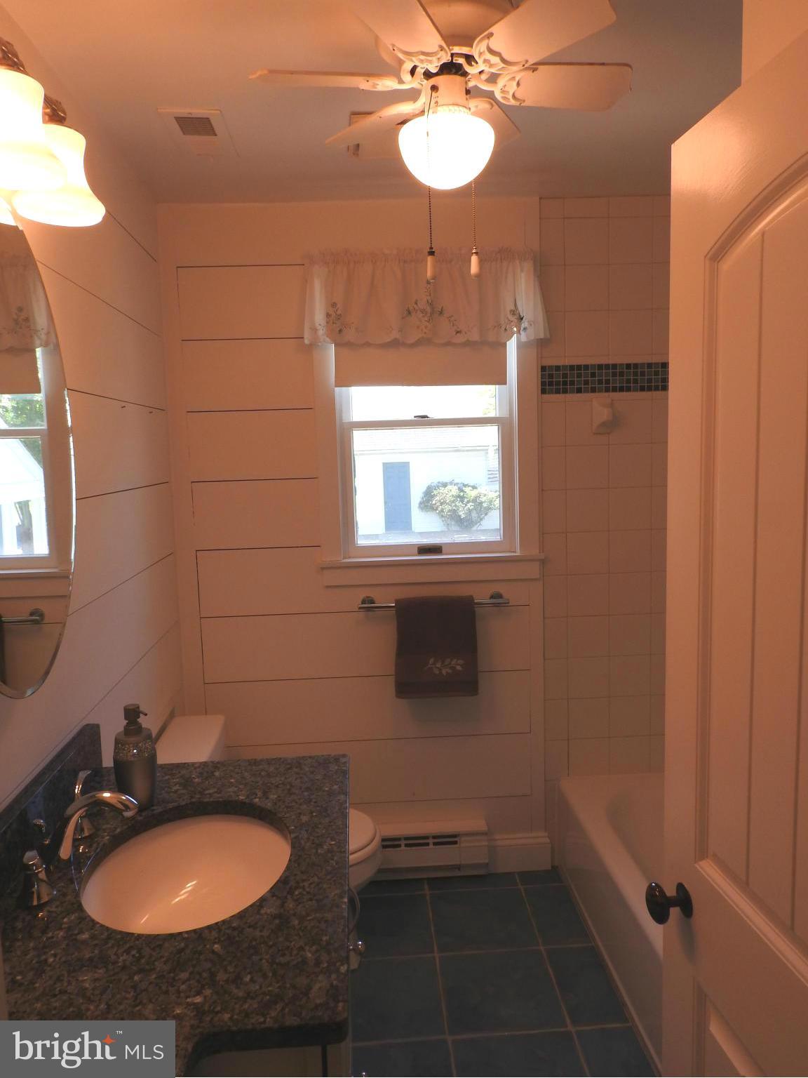 1540 Deep Point Road Woolford, MD 21677 - Photo 14 of 30 a bathroom with a sink and a mirror