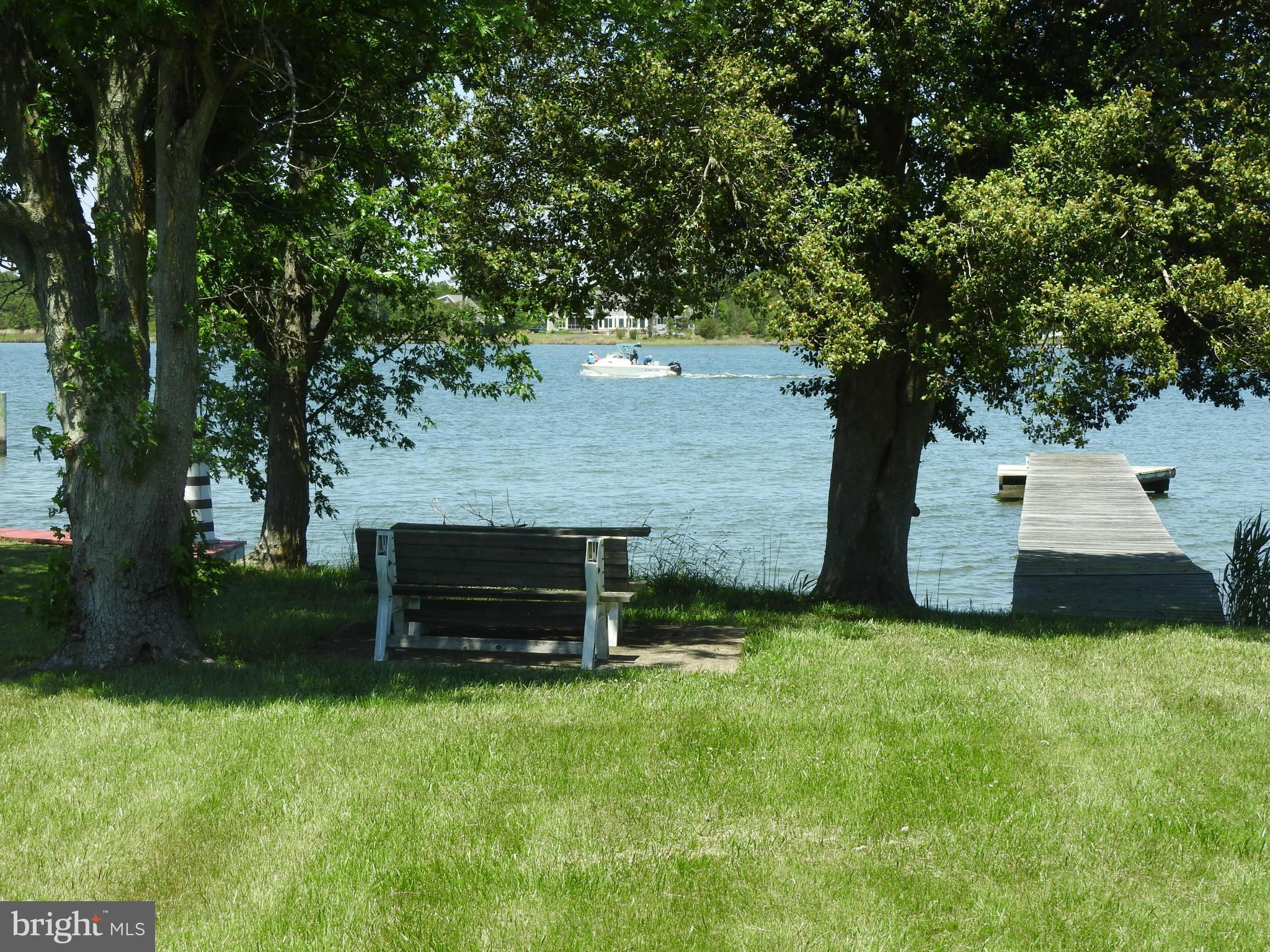 1540 Deep Point Road Woolford, MD 21677 - Photo 5 of 30 a backyard of a house with table and chairs