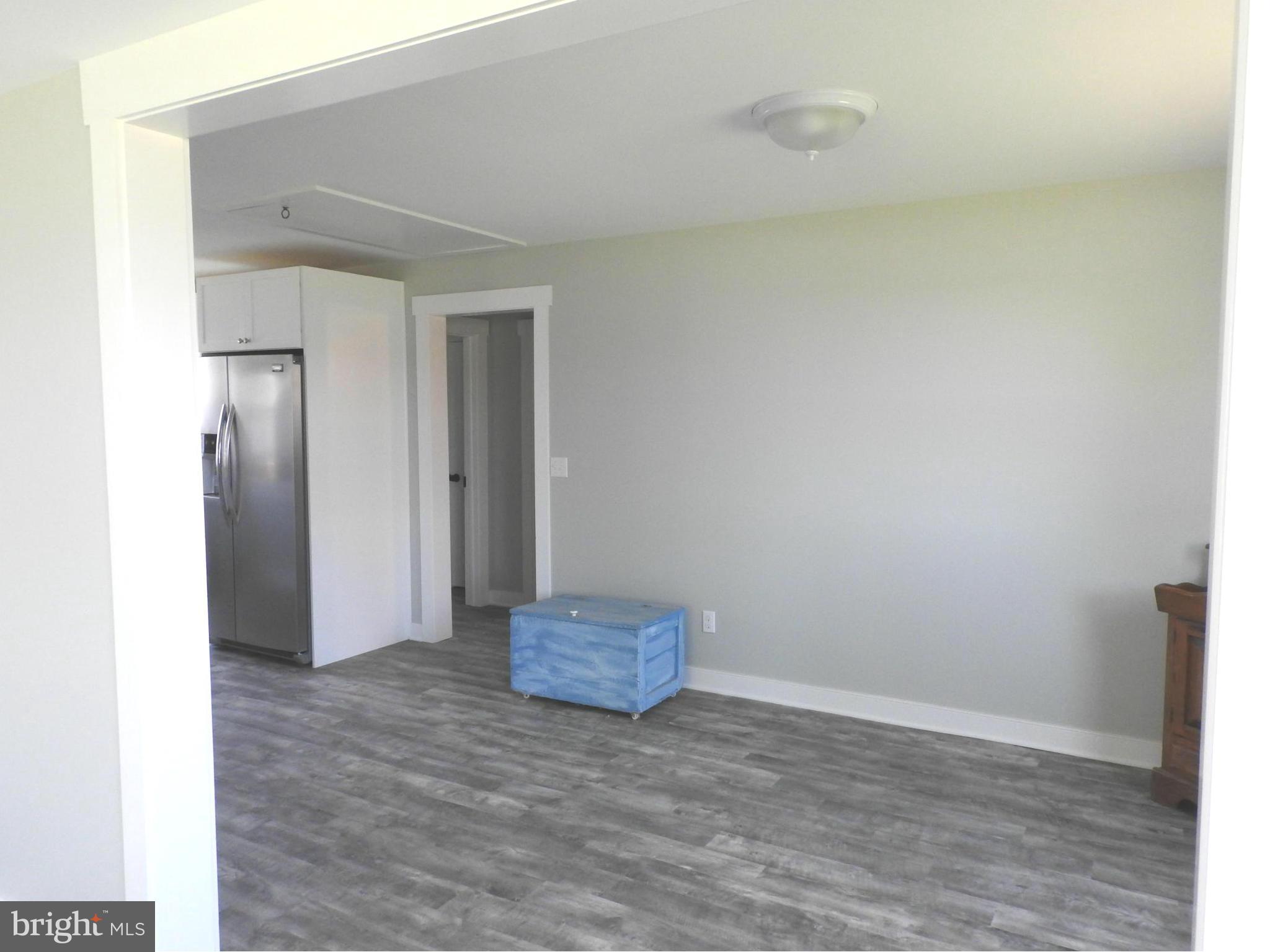 1540 Deep Point Road Woolford, MD 21677 - Photo 10 of 30 a view of empty room with wooden floor