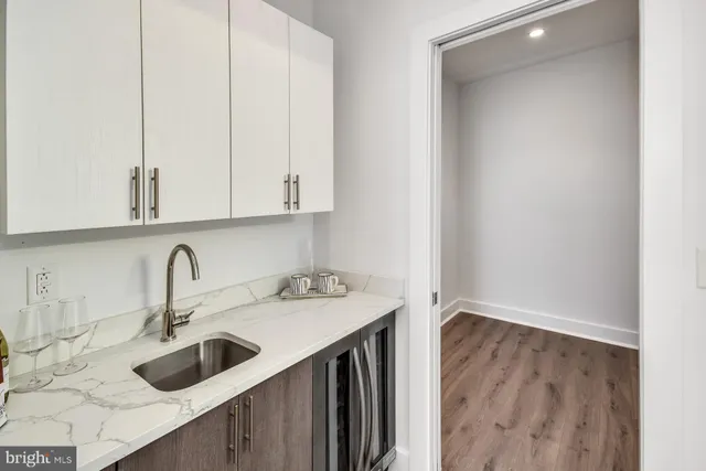 a kitchen with a sink and cabinets