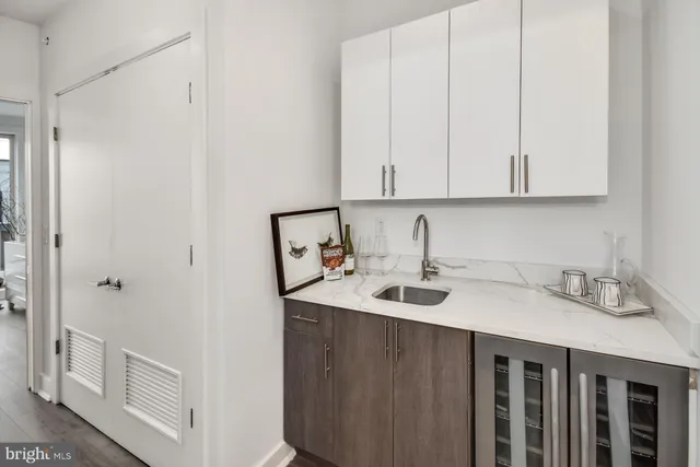 a kitchen with a sink and cabinets