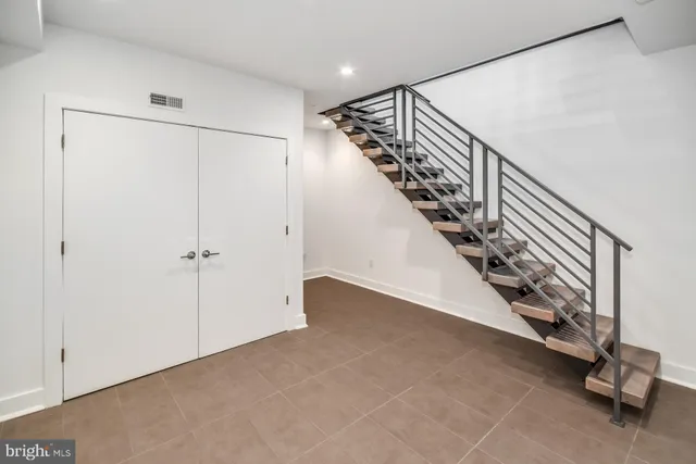 a view of an entryway with stairs